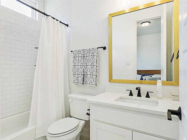 full bathroom with vanity, shower / tub combo with curtain, and toilet