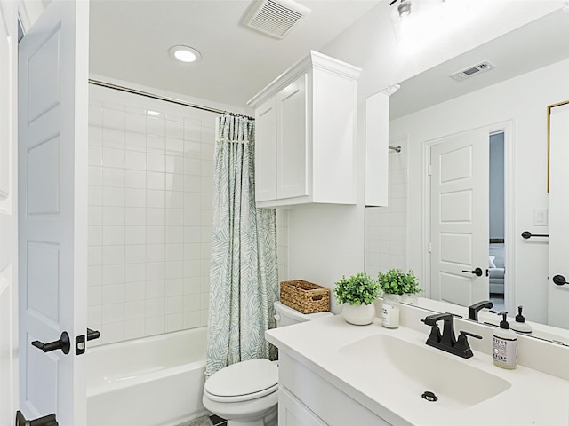 full bathroom featuring vanity, shower / bath combo, and toilet