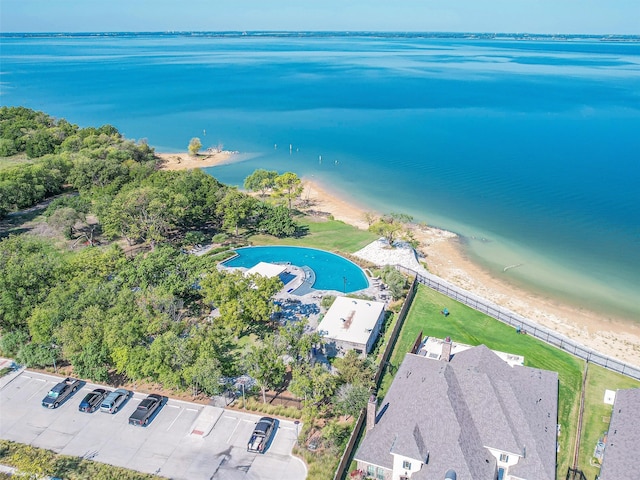 bird's eye view featuring a view of the beach and a water view