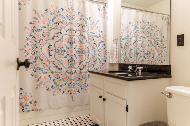 full bathroom with toilet, shower / bath combination with curtain, vanity, and tile patterned floors