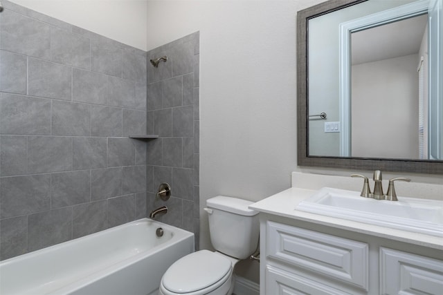 full bathroom featuring vanity, toilet, and tiled shower / bath