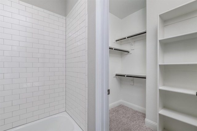 bathroom with tiled shower / bath combo