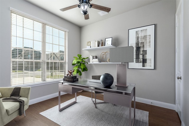 office space with ceiling fan, dark hardwood / wood-style floors, and a wealth of natural light