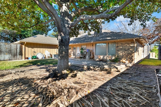 rear view of house featuring a patio