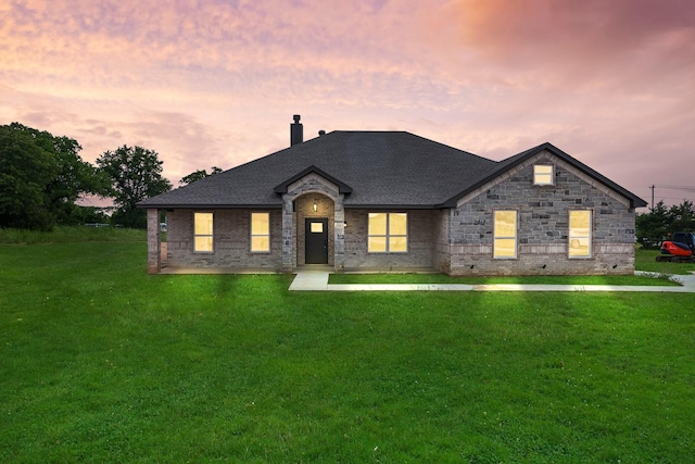 french provincial home featuring a yard