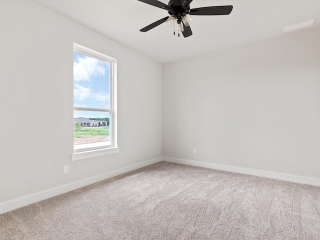 carpeted empty room with ceiling fan