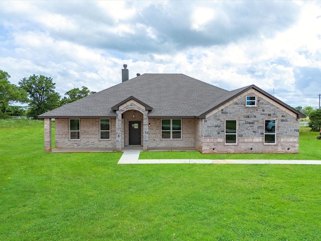 view of front of home with a front yard