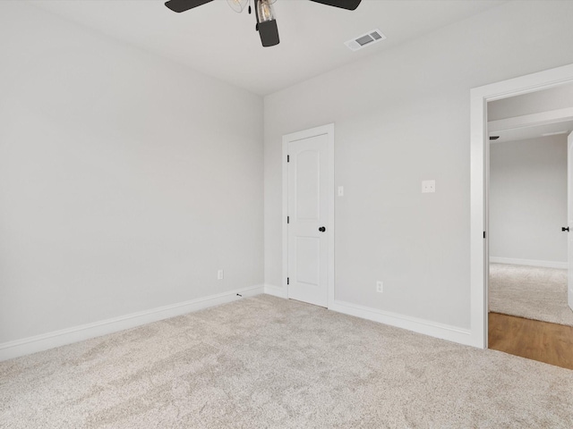 unfurnished room featuring ceiling fan and carpet floors