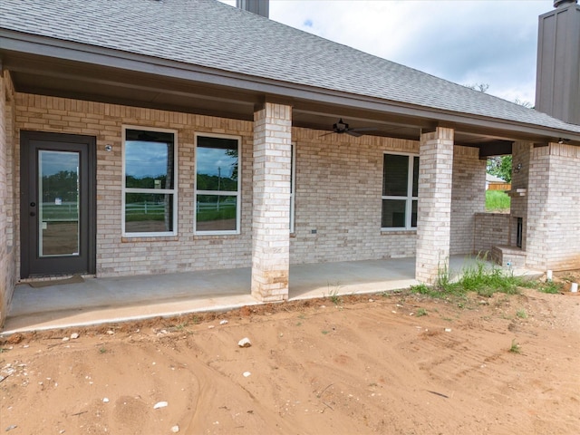 property entrance with ceiling fan and a patio