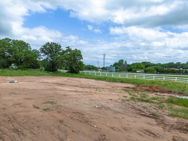 view of yard with a rural view