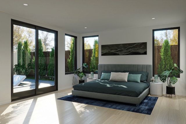 bedroom featuring light wood-type flooring, access to outside, and multiple windows