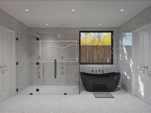 bathroom with separate shower and tub and tile walls