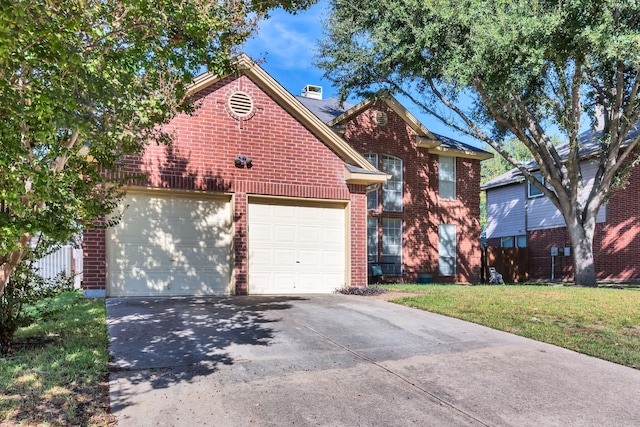 front of property with a garage and a front yard