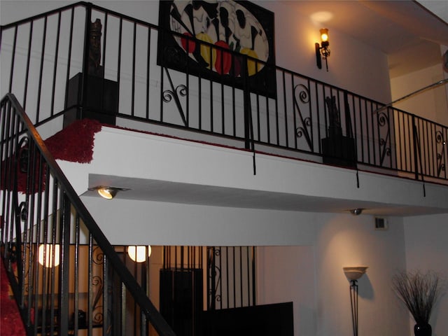 staircase featuring a high ceiling