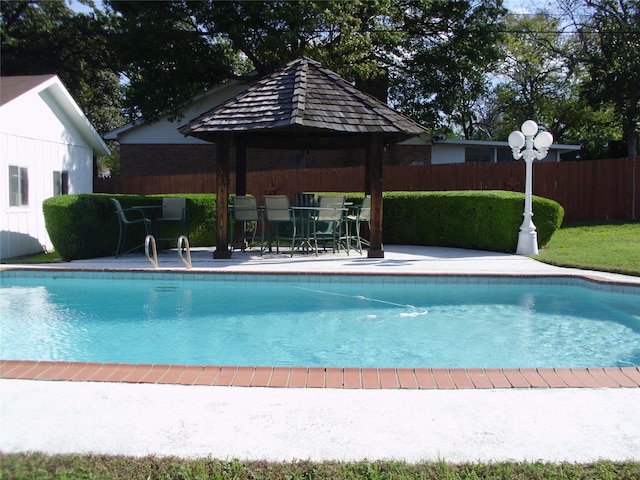 view of swimming pool featuring a gazebo and a patio area