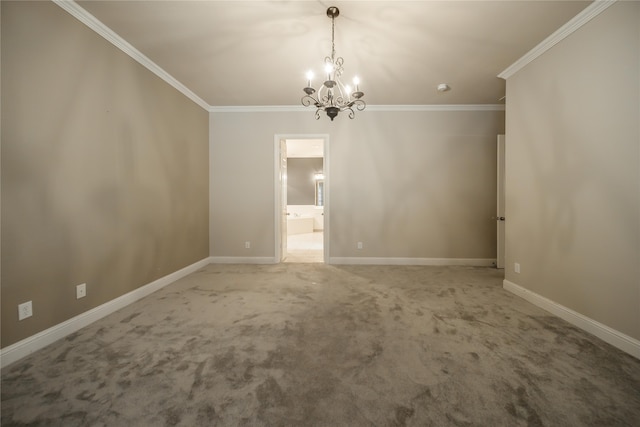 carpeted empty room featuring an inviting chandelier and ornamental molding