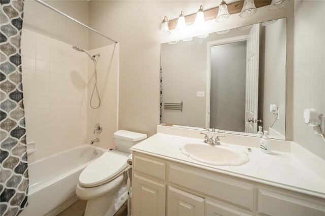 full bathroom featuring vanity, toilet, and shower / bath combo with shower curtain