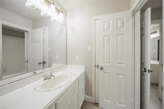 bathroom with vanity and a tub