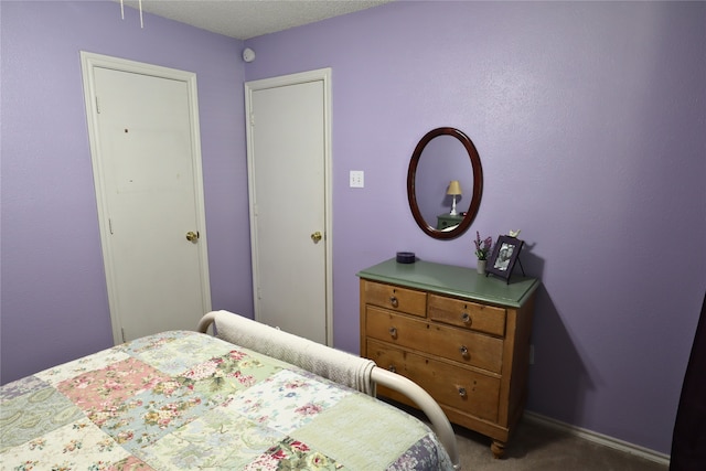 bedroom with dark carpet