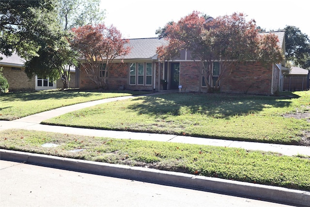 ranch-style house with a front yard