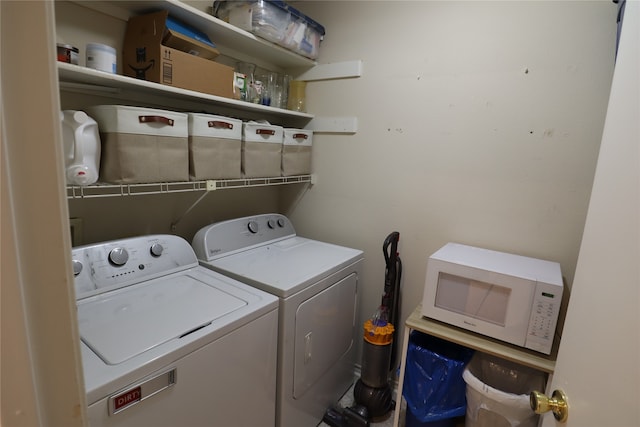 laundry room with washing machine and clothes dryer