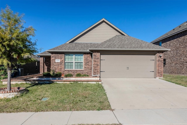 single story home featuring a garage and a front lawn