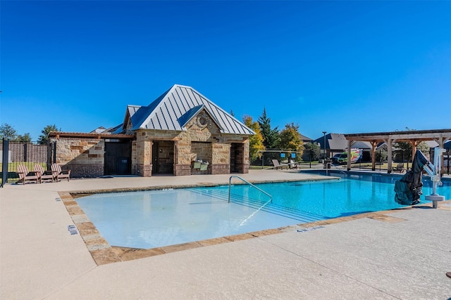 view of swimming pool with a patio