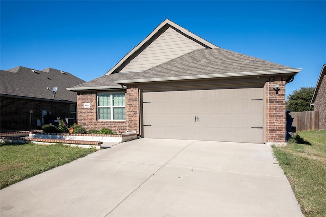 single story home with a front yard and a garage