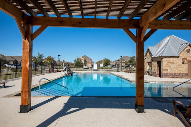 view of swimming pool featuring a patio area and a pergola