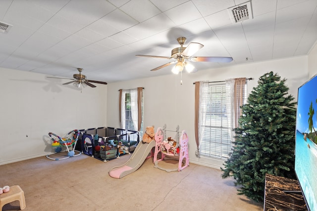 game room featuring ceiling fan and light carpet