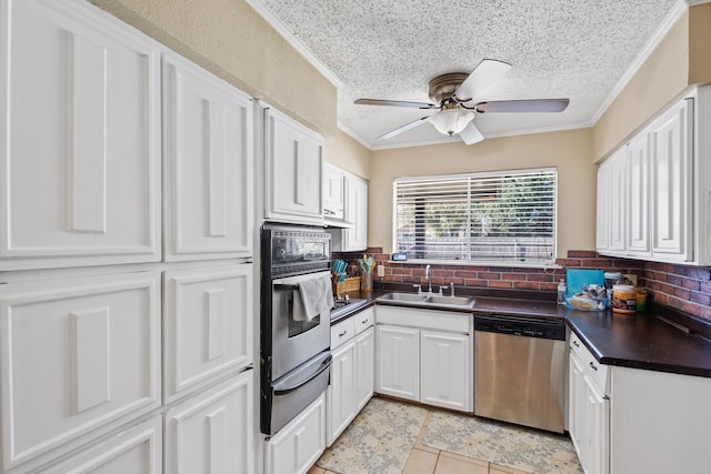 kitchen with white cabinets, sink, a textured ceiling, tasteful backsplash, and stainless steel appliances