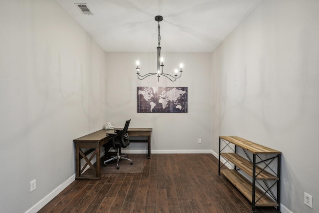 office featuring dark wood-type flooring, visible vents, baseboards, and an inviting chandelier