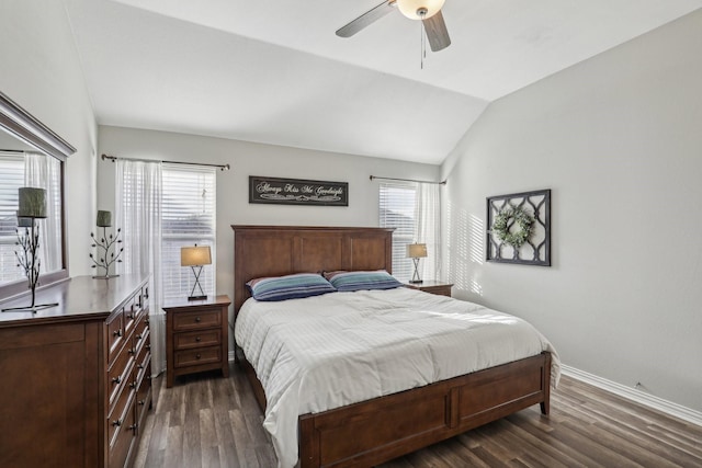 bedroom with lofted ceiling, dark wood-type flooring, a ceiling fan, and baseboards