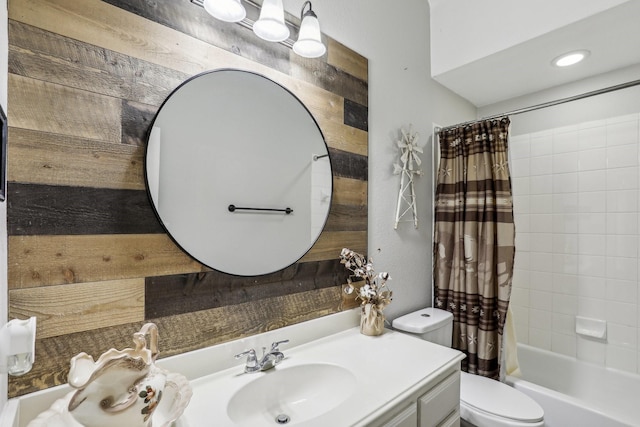 full bath with toilet, shower / bath combo, and vanity