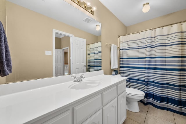 bathroom featuring tile patterned floors, vanity, and toilet