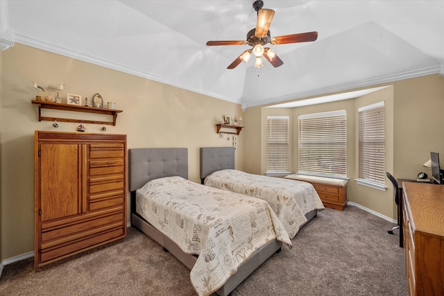 carpeted bedroom with ceiling fan, lofted ceiling, and crown molding