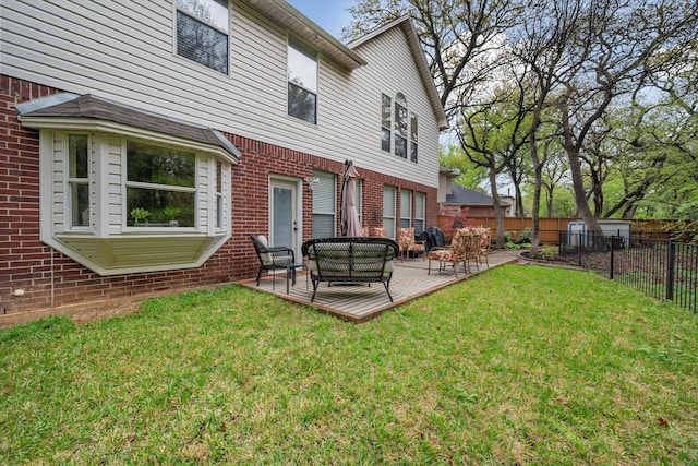 back of house with outdoor lounge area, a patio area, and a lawn