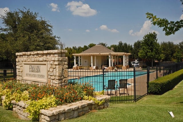 view of pool featuring a lawn and a patio area