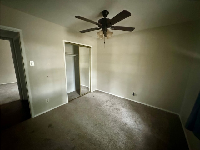 unfurnished bedroom with ceiling fan, carpet floors, and a closet