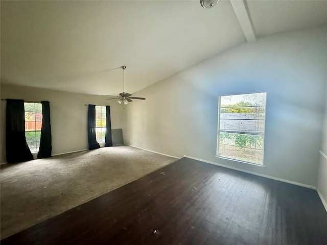 spare room with vaulted ceiling with beams, ceiling fan, and dark hardwood / wood-style flooring