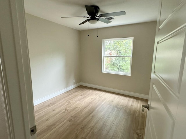 unfurnished room featuring ceiling fan and light wood-type flooring