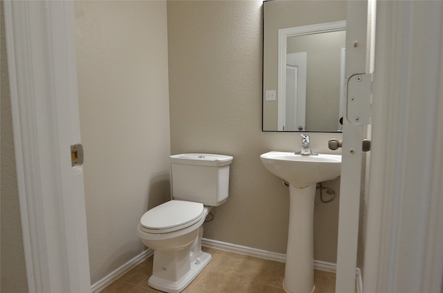 bathroom featuring tile patterned floors and toilet