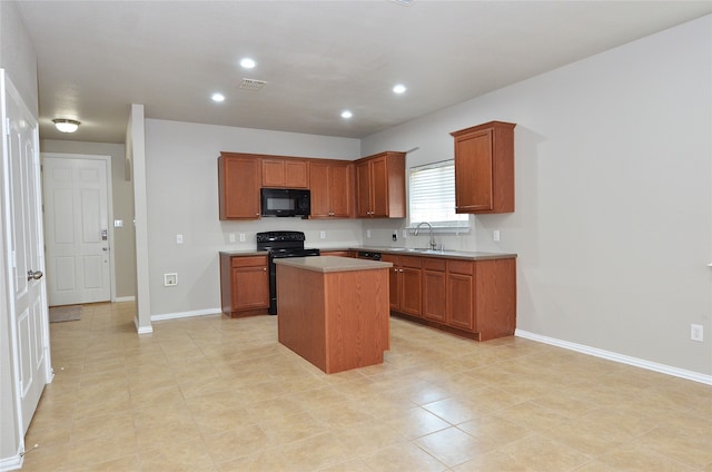 kitchen with a center island, light tile patterned flooring, black appliances, and sink