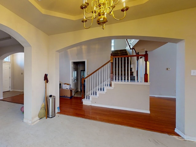 interior space featuring hardwood / wood-style flooring and a notable chandelier