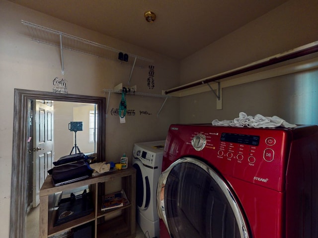 washroom featuring washing machine and dryer