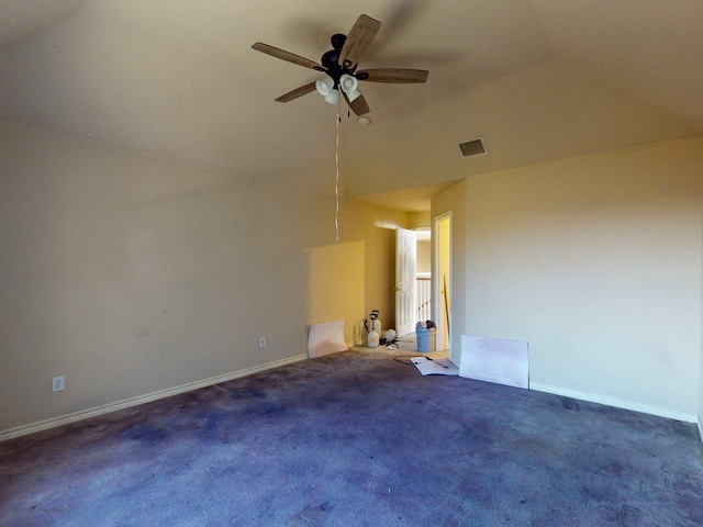 spare room featuring ceiling fan, high vaulted ceiling, and dark carpet