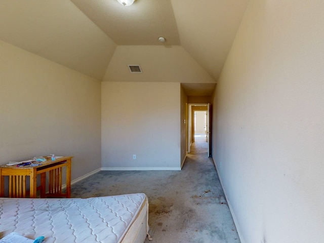 bedroom with light carpet and lofted ceiling