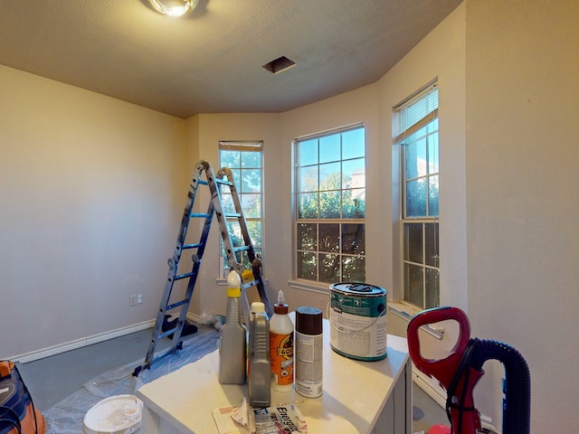 interior space with a textured ceiling