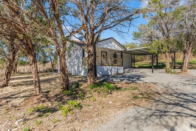 exterior space featuring a carport