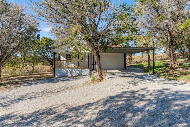 view of front of house with a carport and covered porch